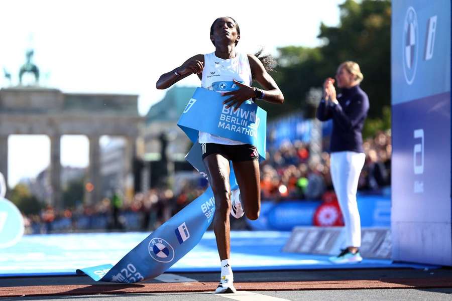 Assefa crossing the finish line