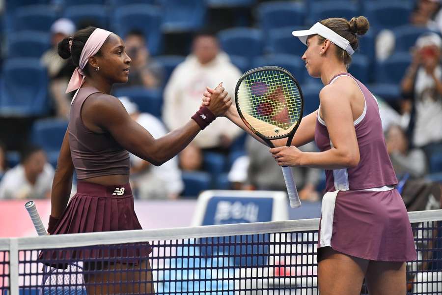 Gauff (L) and Mertens shake hands at the net Gauff (L) and Mertens shake hands at the net