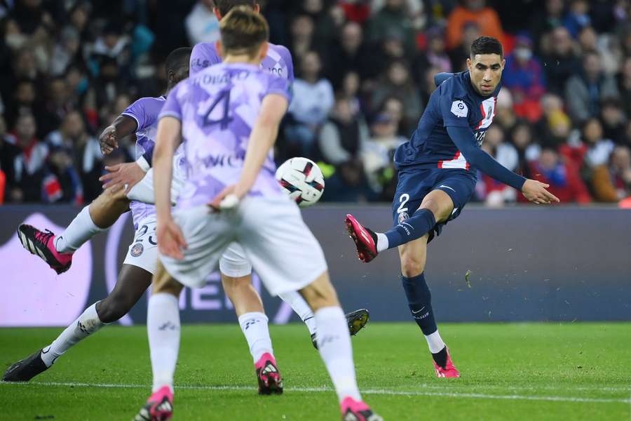 Paris Saint-Germain's Moroccan defender Achraf Hakimi (R) shoots and scores his team's first goal Paris Saint-Germain's Moroccan defender Achraf Hakimi (R) shoots and scores his team's first goal