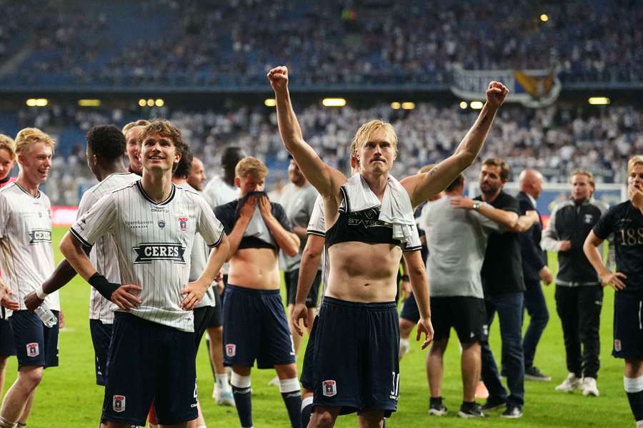 AGF celebrate their progression to the third qualifying round of the UEFA Champions League. AGF celebrate their progression to the third qualifying round of the UEFA Champions League.