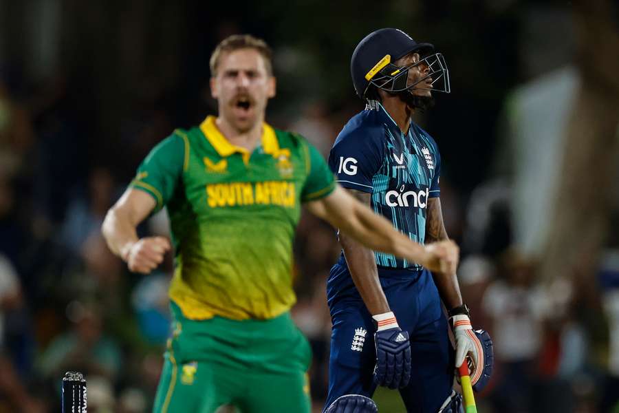 England's Jofra Archer reacts after being dismissed by South Africa's Anrich Nortje