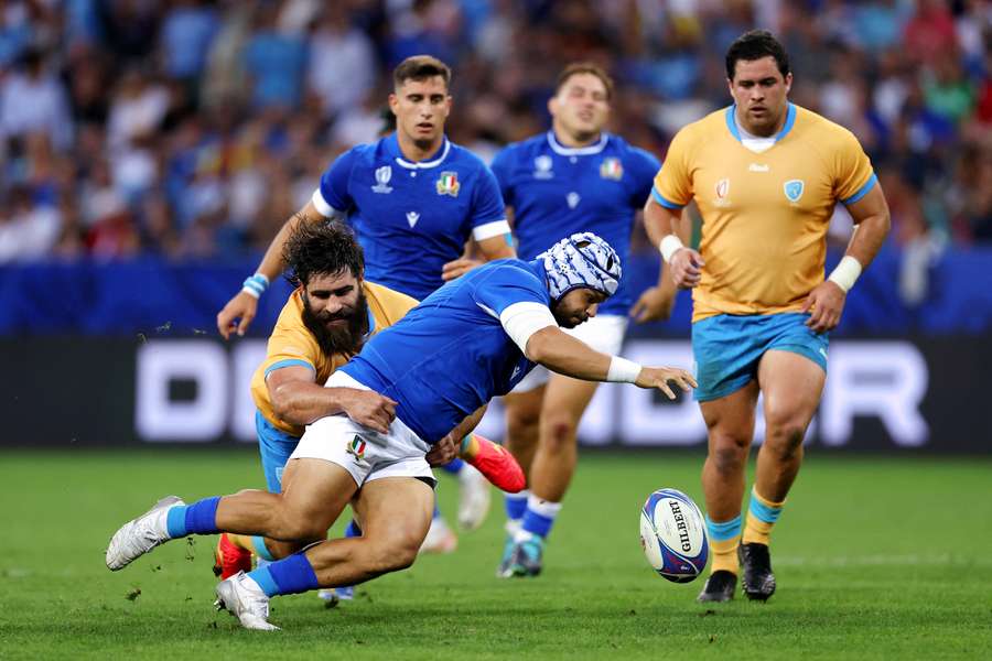 Luca Bigi of Italy is tackled by Diego Arbelo of Uruguay during the Rugby World Cup France 2023