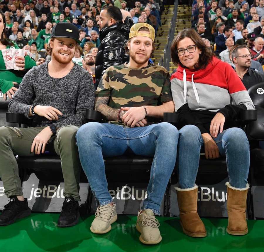 Martin Pala (left) with David Pastrnak and his mom during a visit to an NBA game