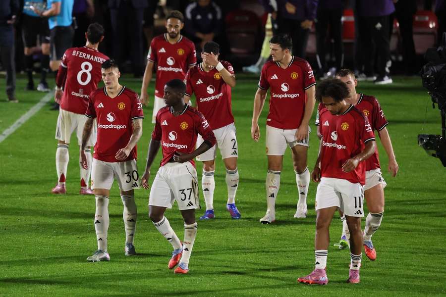 The Manchester United team look dejected after their defeat at Grimsby Town The Manchester United team look dejected after their defeat at Grimsby Town