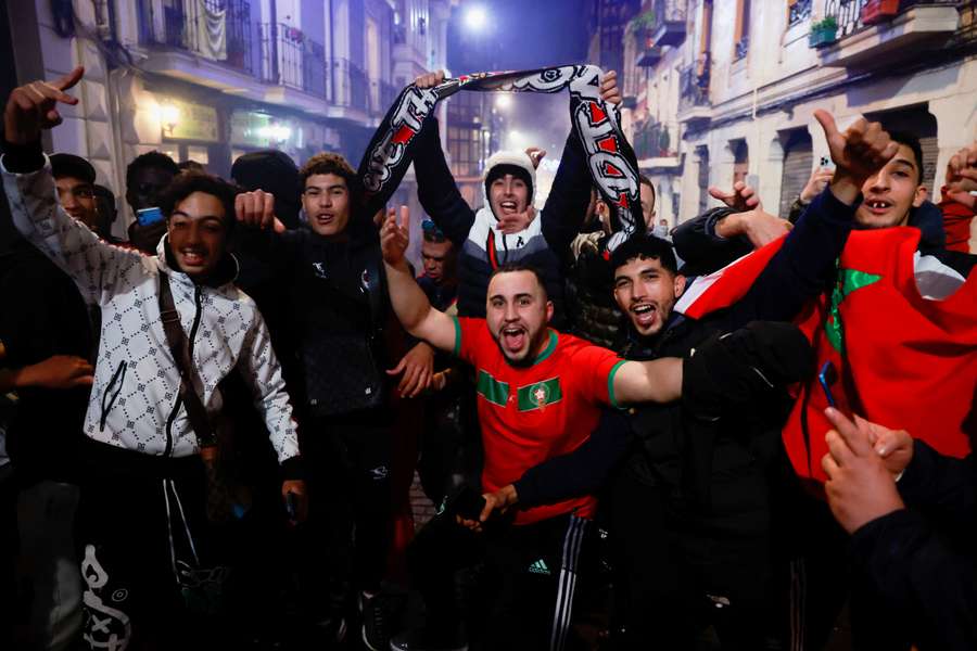 Moroccan fans celebrate the win in Bilbao, Spain
