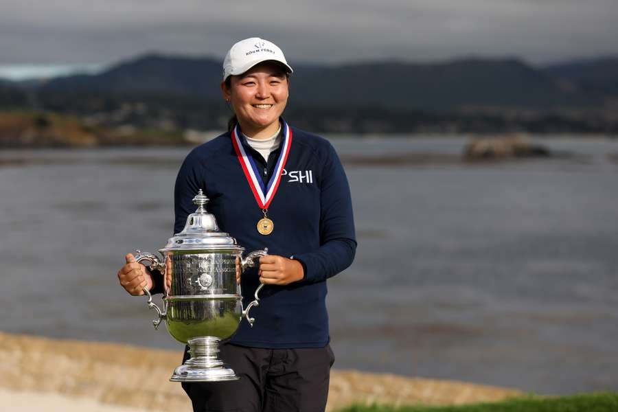 Allisen Corpuz celebrates with the Harton S. Semple Trophy after winning the 78th US Women's Open