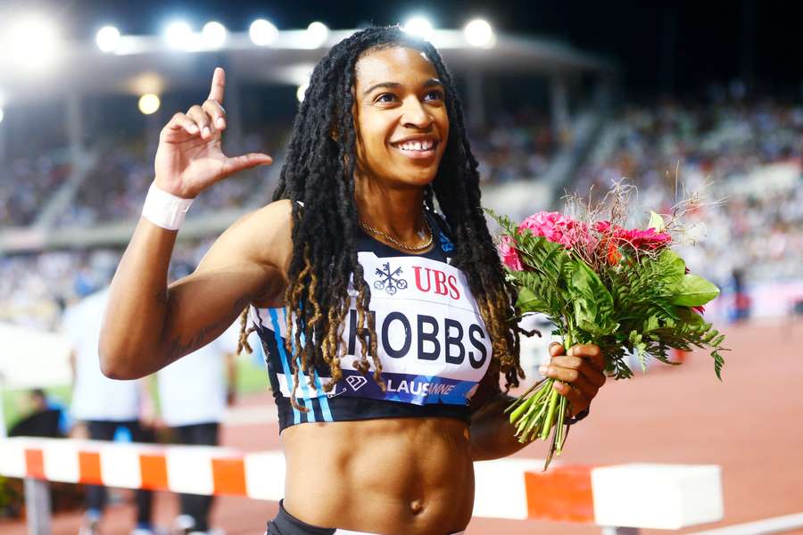 Hobbs celebrates her triumph in the 100 metres