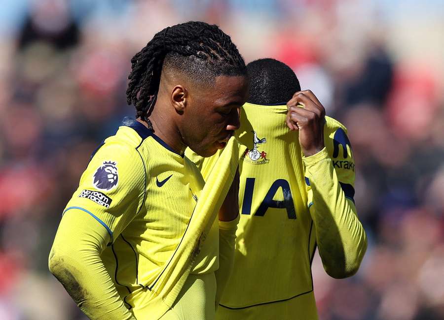 Tottenham Hotspur's Destiny Udogie and Randal Kolo Muani look dejected