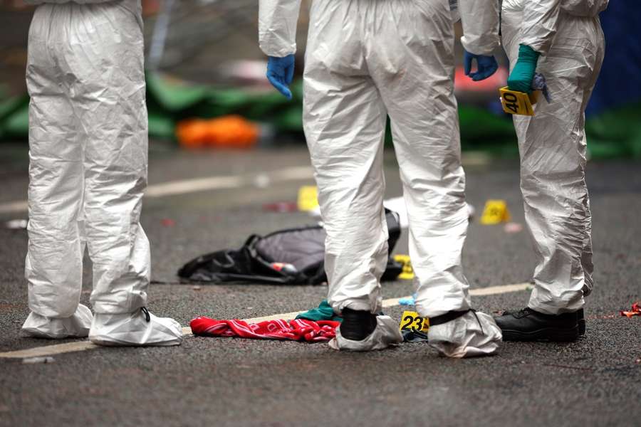 Emergency services treat members of the public inside a police cordon at the scene of the incident in Liverpool