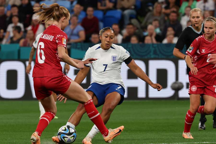 England's forward #07 Lauren James (C) scores her team's first goal