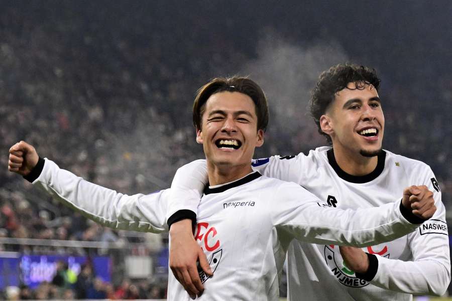 NEC's Kodai Sano celebrates scoring the 3-1 against AZ with team-mate Sami Ouaissa