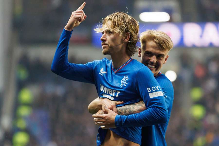 Todd Cantwell of Rangers celebrates his teams 3rd goal with teammate Ross McCausland