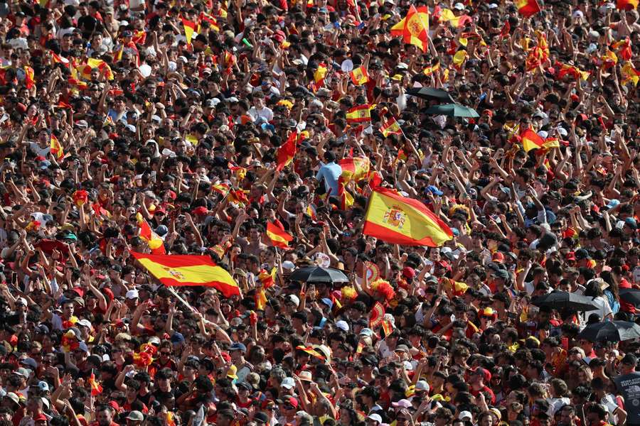 Spain fans gather at Cibeles Square in Madrid ahead of the parade as they celebrate winning the World Cup Spain fans gather at Cibeles Square in Madrid ahead of the parade as they celebrate winning the World Cup