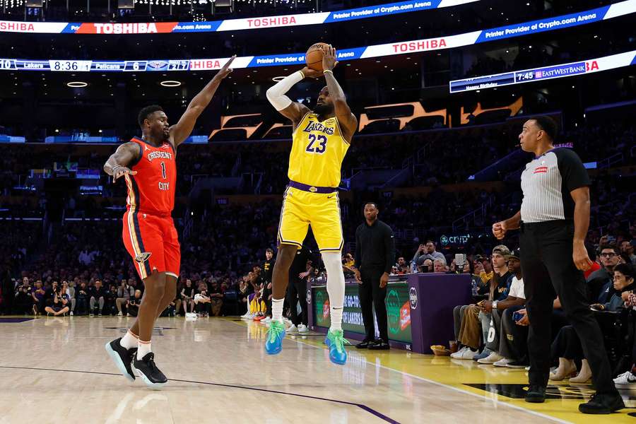 LeBron James of the Los Angeles Lakers scores during the first half against Zion Williamson of the New Orleans Pelicans