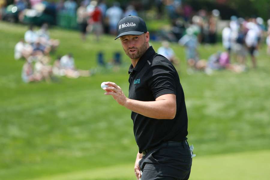Wyndham Clark acknowledges the gallery on the 18th green during the first round of The Memorial Tournament