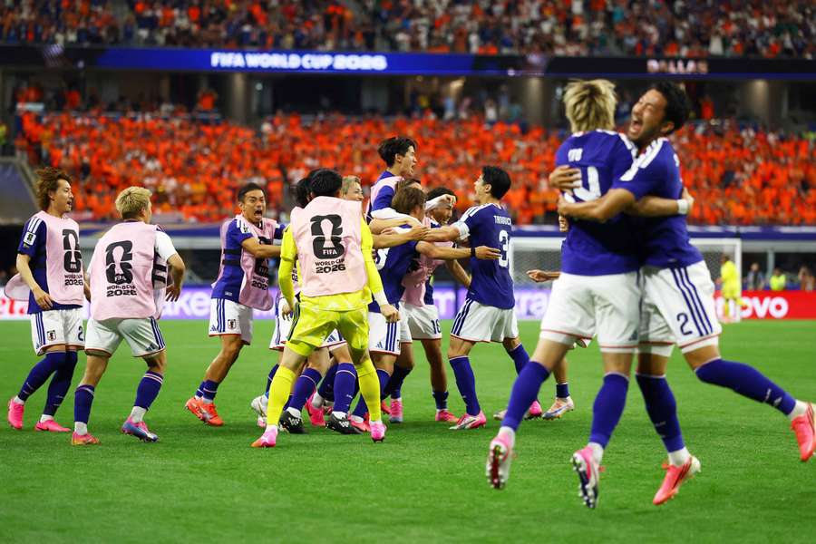 Japan's Koki Ogawa and Yukinari Sugawara celebrate after Daichi Kamada scored their second goal Japan's Koki Ogawa and Yukinari Sugawara celebrate after Daichi Kamada scored their second goal