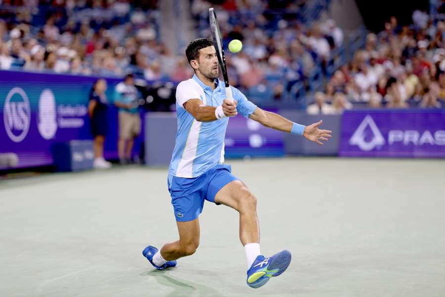 Djokovic returns the ball against Fritz