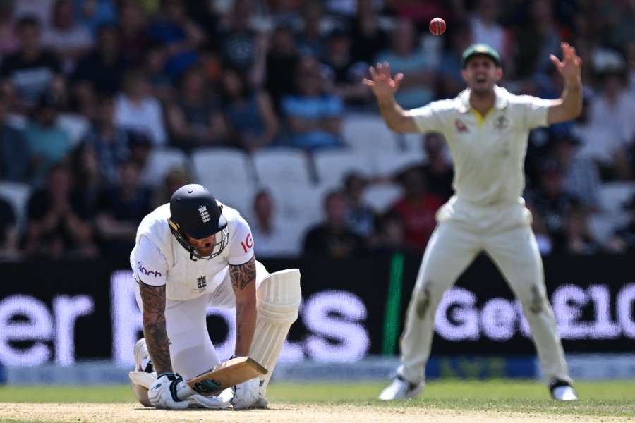 England's captain Ben Stokes reacts after being hit by a ball from Australia's Scott Boland