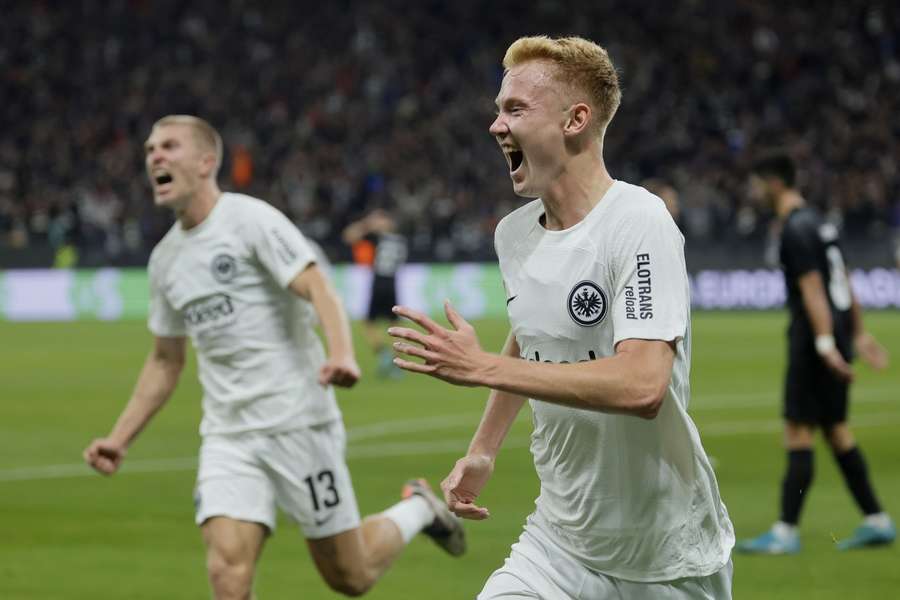 Hugo Larsson (R) of Frankfurt celebrates after scoring