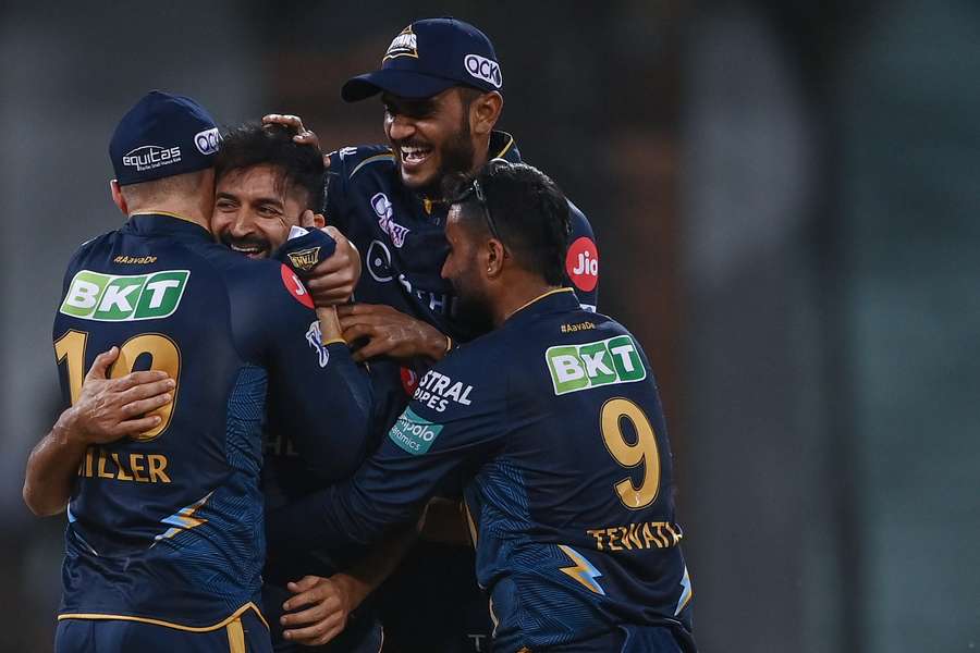 Gujarat Titans' players celebrate after winning the match