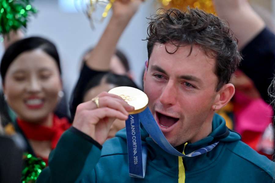 Cooper Woods celebrates with his skiing mogul's gold medal in Sydney.