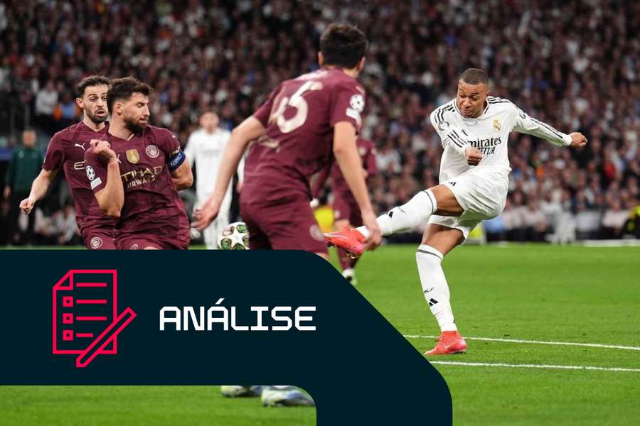 Kylian Mbappé, do Real Madrid, vê um remate bloqueado por Rúben Dias, do Manchester City Kylian Mbappé, do Real Madrid, vê um remate bloqueado por Rúben Dias, do Manchester City