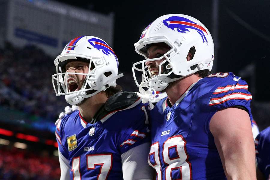 Josh Allen of the Buffalo Bills celebrates his rushing touchdown with teammate Dawson Knox against the Kansas City Chiefs