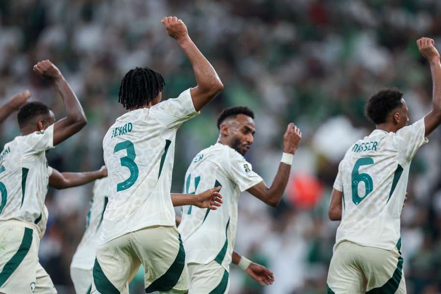 Saudi Arabia celebrate their third goal scored by Firas Al Braikan