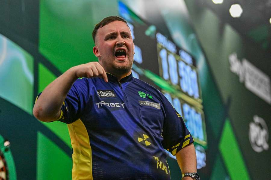 Littler celebrates during the match with Meikle