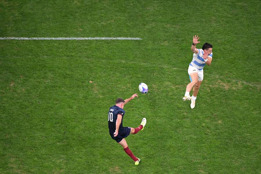 England fly-half George Ford kicks a drop goal against Argentina