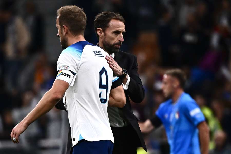 England coach Gareth Southgate comforts Harry Kane after their 1-0 defeat away to Italy.