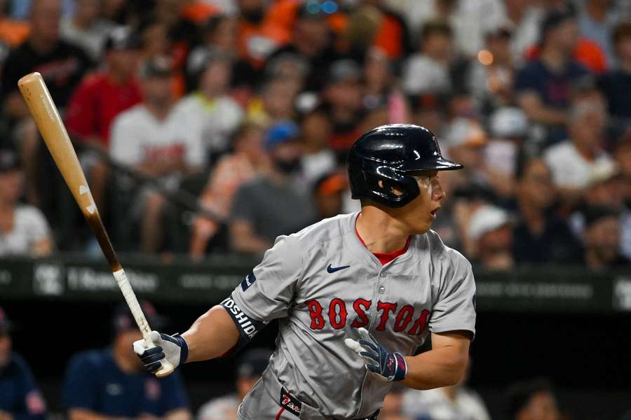 Boston Red Sox left fielder Masataka Yoshida swings through a third-inning single against the Baltimore Orioles