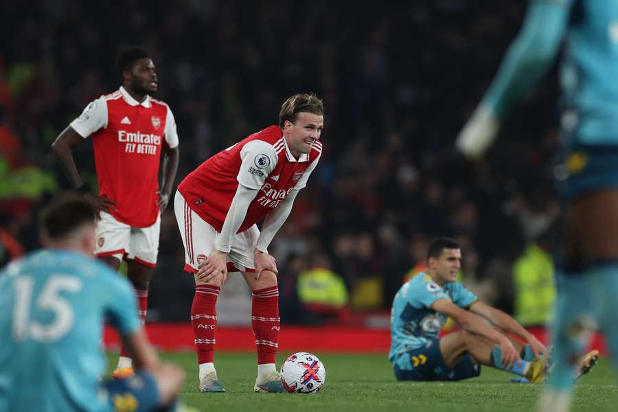 Arsenal's English defender Rob Holding (C) reacts on the pitch after the English Premier League football match between Arsenal and Southampton at the Emirates Stadium