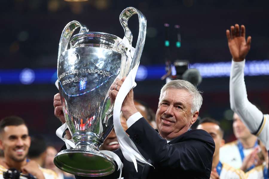 Ancelotti holds up the trophy