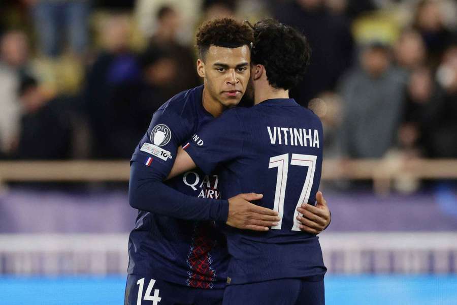 Paris Saint-Germain's Desire Doue celebrates scoring their third goal with Vitinha