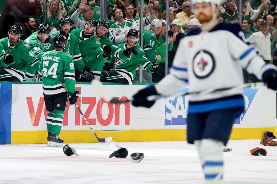 Dallas Stars' Mikael Granlund celebrates with the bench after completing a hat-trick