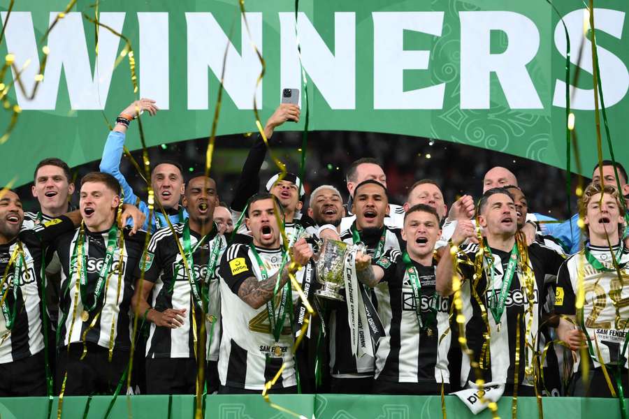 Bruno Guimaraes and Kieran Trippier lift the Carabao Cup after beating Liverpool in the 2025 final