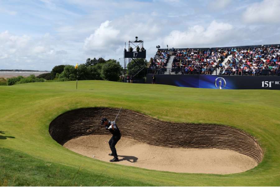 Brian Harman plays out of a bunker on the 17th hole during the second round