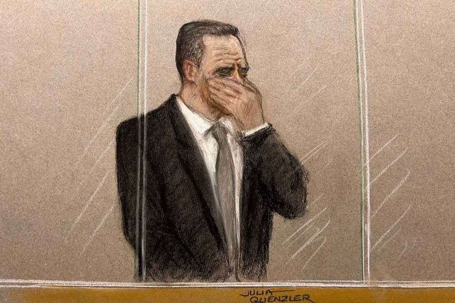 Paul Doyle is seen crying in the dock at Liverpool Crown Court in the early stages of his trial before the jury was signed in Paul Doyle is seen crying in the dock at Liverpool Crown Court in the early stages of his trial before the jury was signed in