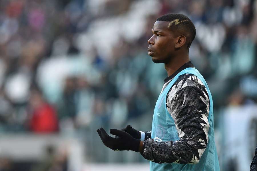 Juventus' Paul Pogba warms up 