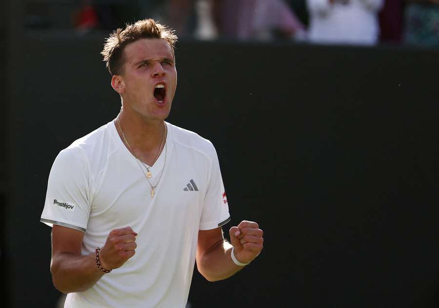 Mensik celebrates win