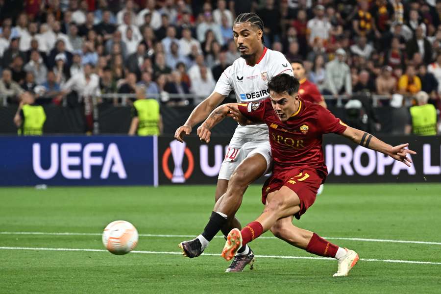 Paulo Dybala scores the opening goal for Roma