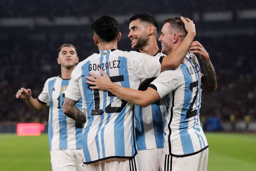Romero celebrates his goal with his teammates