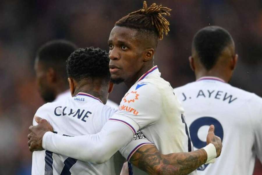 Wilfried Zaha celebrates putting Crystal Palace level against West Ham