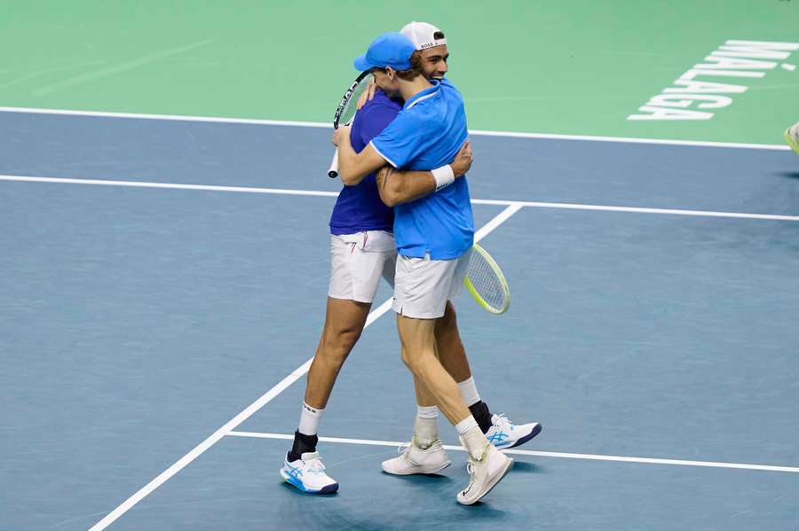 Jannik Sinner, right, celebrates with Matteo Berrettini after their doubles win