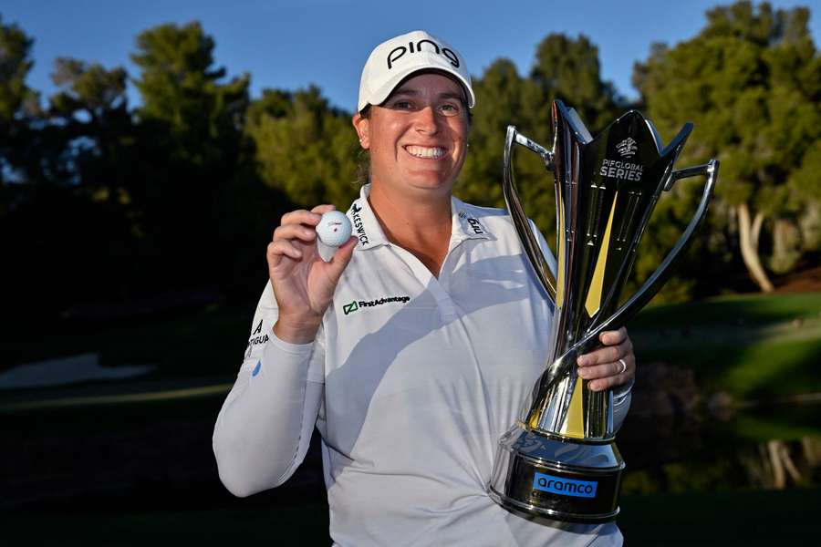 Lauren Coughlin poses with the trophy after a five-stroke victory in the LPGA Aramco Championship Lauren Coughlin poses with the trophy after a five-stroke victory in the LPGA Aramco Championship