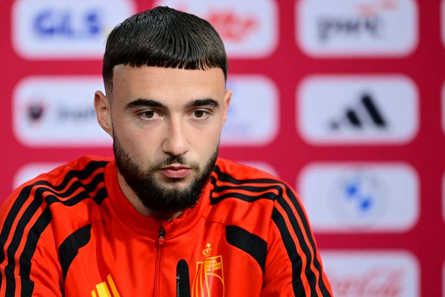 Belgium defender Debast speaks to the press