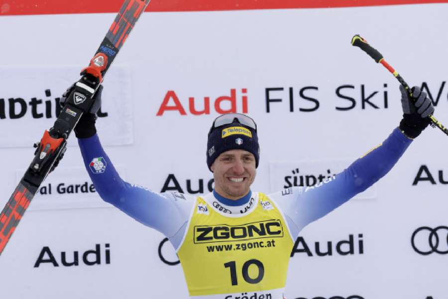 Italy's Mattia Casse celebrates on the podium after winning the Men's Super G 