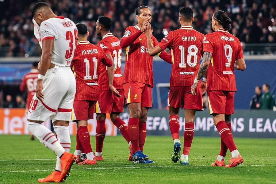 Liverpool players celebrate a goal.