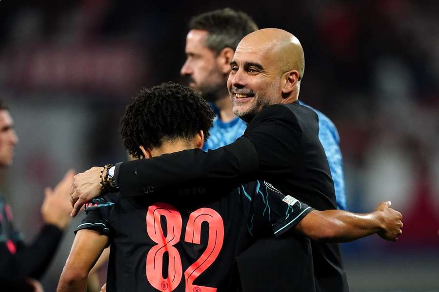 Guardiola embraces Lewis after the match